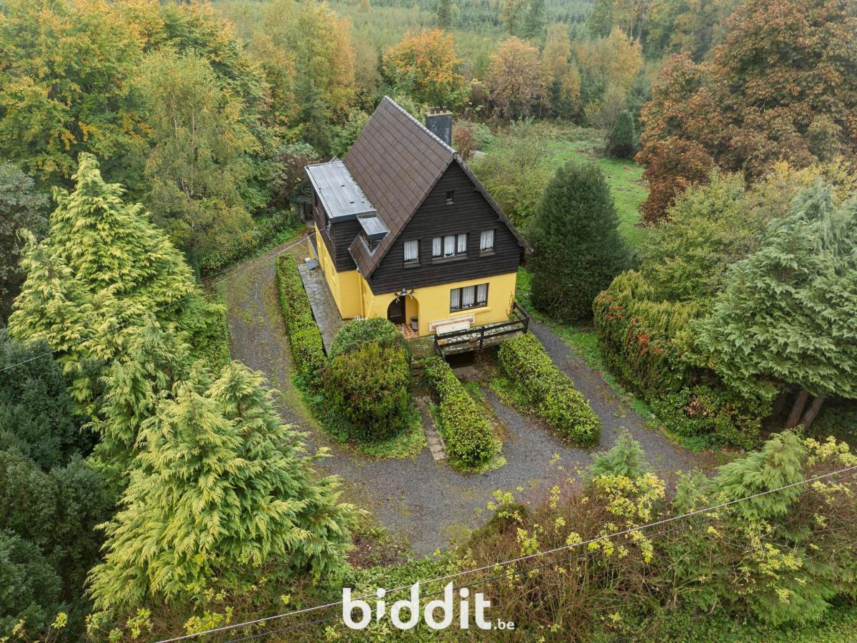 Maison 4 façades avec jardin et garage